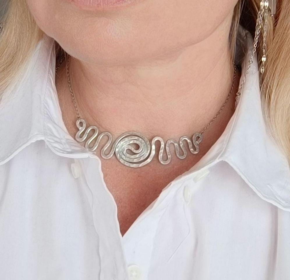 Minimalist choker with adjustable clasp for multiple styling options.