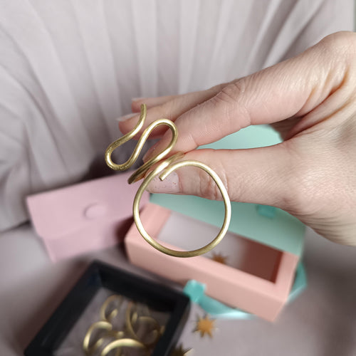 Large minimalist brass ring, handcrafted and adjustable. Open design, perfect for both men and women. Stylish statement jewelry with a bold modern look. Ideal for everyday wear or special occasions. Comes in elegant gift packaging.