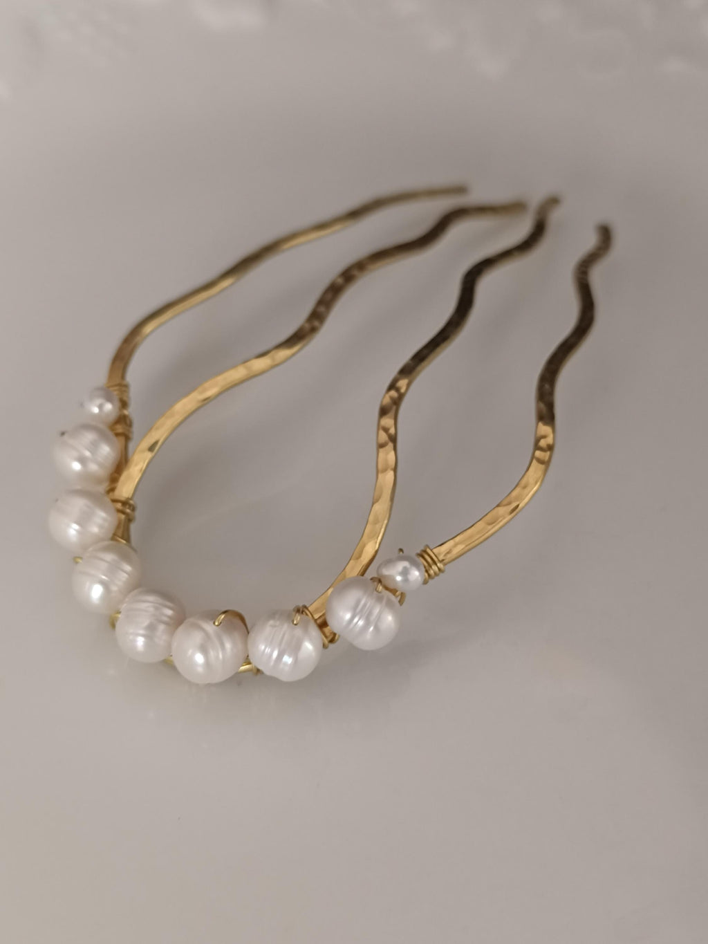 Hand-forged brass and freshwater pearl hair comb