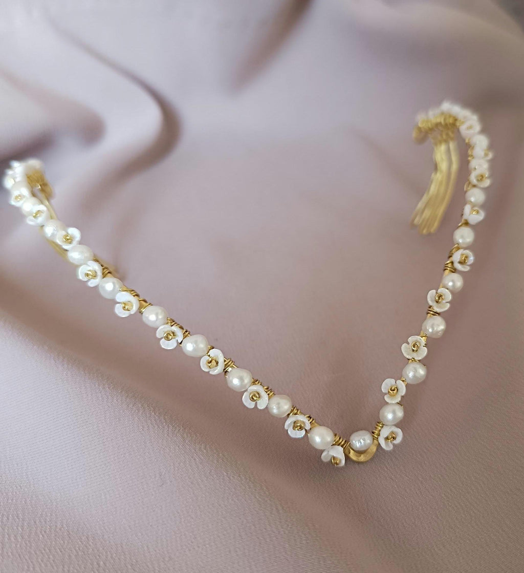 delicate handmade brass tiara with pearls, styled in an elegant twist braid hairstyle